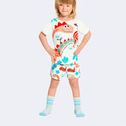 Pijama Kids Alakazoo Brilha no Escuro Dinossauro Branco e Colorido - menina com o pijama
