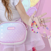 Bolsa Infantil Pampili Pam Surprise Strap Fone Estampa e Glitter Branca e Colorida - Vem com mimo especial - frente da bolsa com glitter 