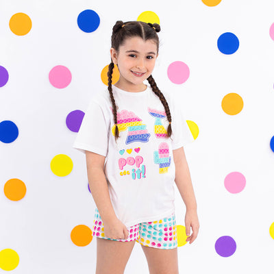 Pijama Kids Cara de Criança Brilha no Escuro Pop It Branco e Colorido - 4 a 8 Anos - menina com o pijama infantil